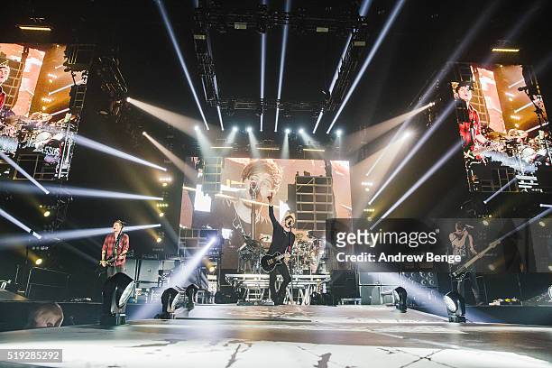 Michael Clifford, Luke Hemmings and Calum Hood of 5 Seconds Of Summer perform on stage at Sheffield Arena on April 5, 2016 in Sheffield, England.