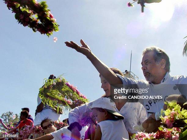 East Timor President Xanana Gusmao throws a flower wreath into the sea in front of the government office in downtown Dili, 09 January 2005, as part...