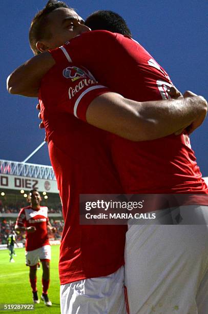 Mexico´s Toluca player Alexis Vega celebrates with his teammate Gerardo Rodriguez his goal against Ecuador´s Liga Deportiva Universitaria de Quito,...