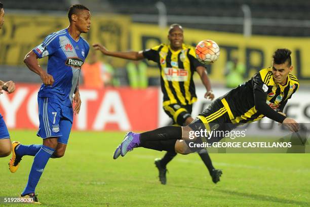 Venezuelan Tachira's Wilker Angel vies for the ball with Ecuadorean Emelec's Henry Leon during a Libertadores Cup football match in San Cristobal,...