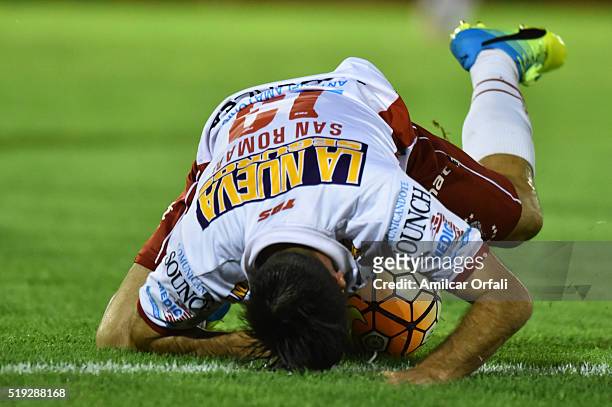 Jose San Roman of Huracan falls over the ball during a match between Huracan and Sporting Cristal as part of Group 4 of Copa Bridgestone Libertadores...