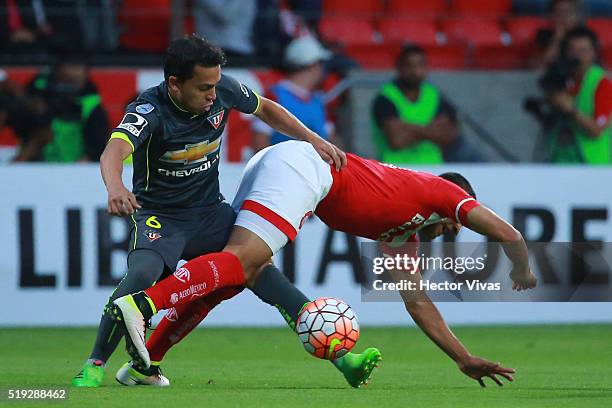 Alexis Vera of Toluca struggles for the ball with Edison Vega of LDU Quito during a match between Toluca and LDU Quito as part of the Copa...