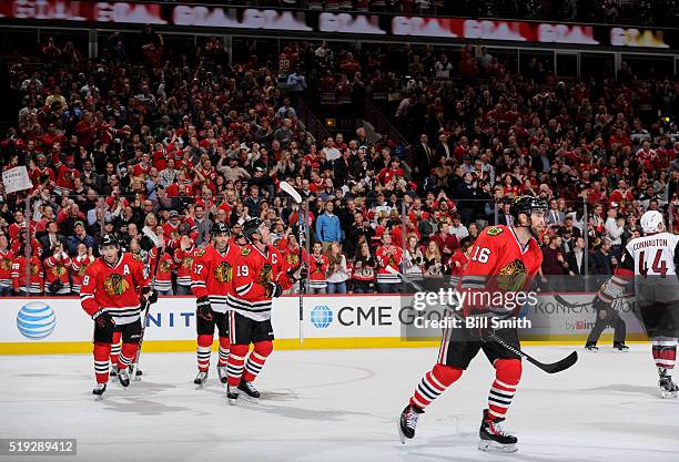 Andrew Ladd of the Chicago Blackhawks skates ahead of teammates Patrick Kane, Trevor van Riemsdyk and Jonathan Toews, after scoring against the...