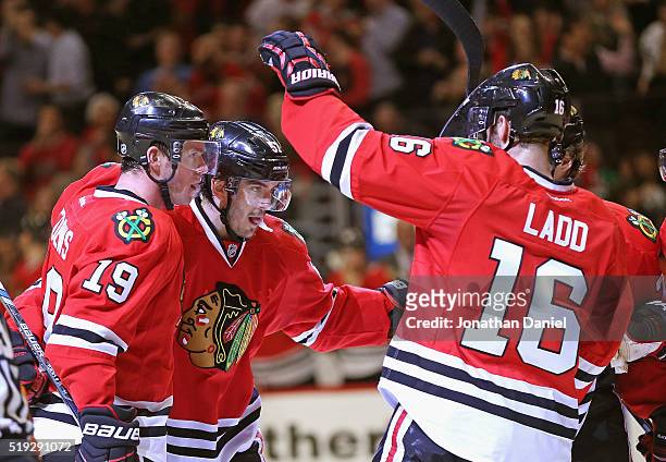 Jonathan Toews and Andrew Ladd of the Chicago Blackhawks celebrate a second period goal by Trevor van Riemsdyk against the Arizona Coyotes at the...