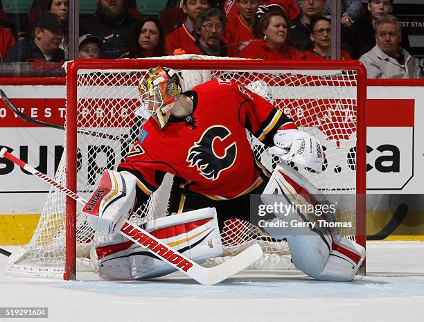 Joni Ortio of the Calgary Flames makes a save against the Los Angeles King at Scotiabank Saddledome on April 5, 2016 in Calgary, Alberta, Canada.