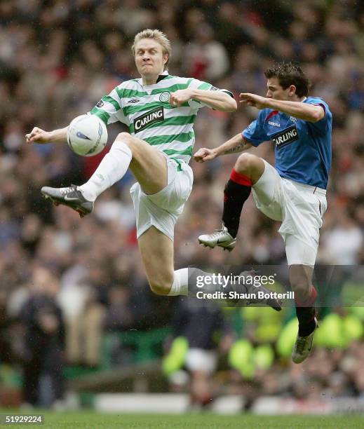 Ulrik Laursen of Celtic and Nacho Novo of Rangers challenge for the ball during the Tennants Scottish Cup 3rd round match between Celtic and Rangers...