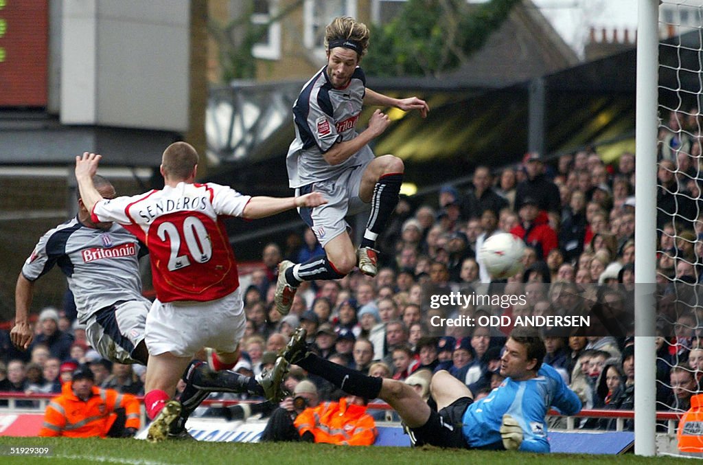 Stoke City's Wayne Thomas (L, partly hid