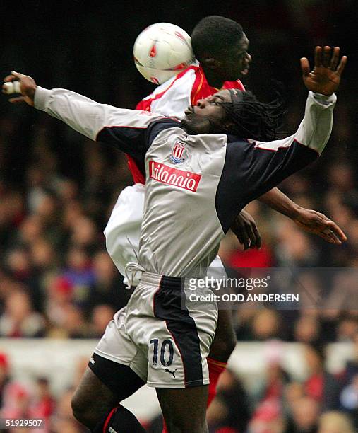 Ade Akinbiyi of Stoke City vies for the ball with Kolo Toure Arsenal during their third round F.A. Cup match at Highbury in north London, 09 January...