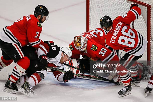 Jordan Martinook of the Arizona Coyotes attempts to get the puck past goalie Scott Darling of the Chicago Blackhawks in the third period of the NHL...