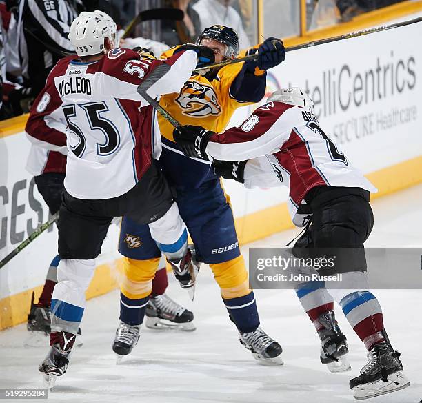 Eric Nystrom of the Nashville Predators collides with Cody McLeod of the Colorado Avalanche during an NHL game at Bridgestone Arena on April 5, 2016...
