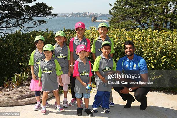 Australian cricketer Gurinder Sandhu poses with young children during the launch of the Asian Sports Partnership Program Launch at Kirribilli House...