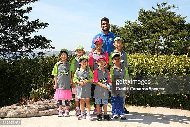 Australian cricketer Gurinder Sandhu poses with young children during the launch of the Asian Sports Partnership Program Launch at Kirribilli House...