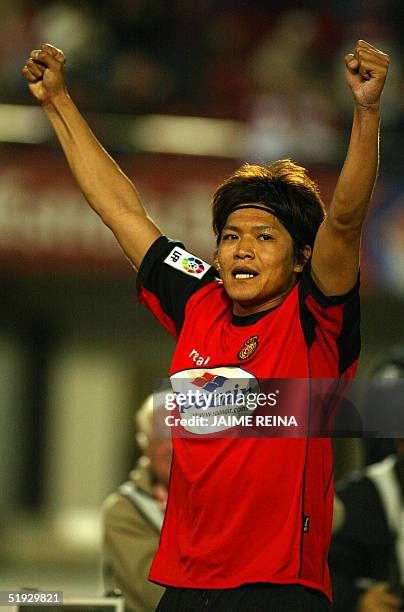 Mallorca's Japan Yoshito Okubo celebrates his first goal against Deportivo during a Spanish soccer League match at the Son Moix stadium in Palma de...