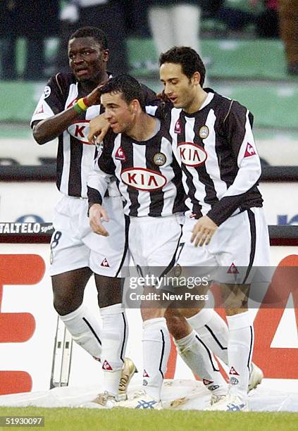 Antonio Di Natale of Udinese celebrates his goal with team mates Sulley Muntari and David Di Michele during the Serie A match between Udinese and...