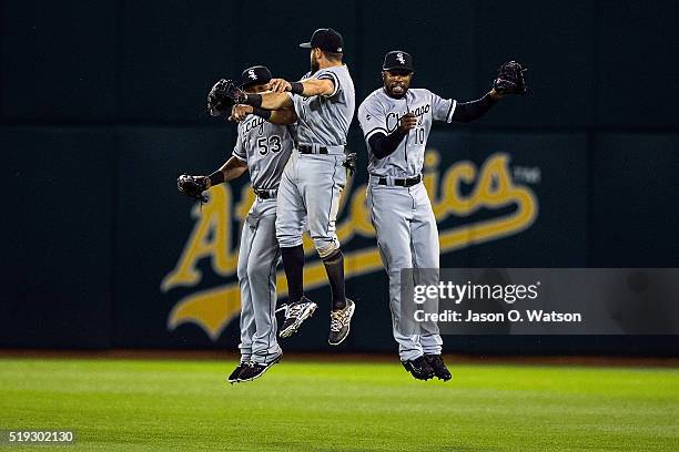 Melky Cabrera of the Chicago White Sox, Adam Eaton and Austin Jackson celebrate after the game against the Oakland Athletics at the Oakland Coliseum...