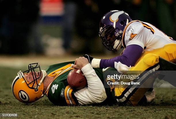 Linebacker Chris Claiborne of the Minnesota Vikings sacks quarterback Brett Favre of the Green Bay Packers in the NFC wild-card game at Lambeau Field...