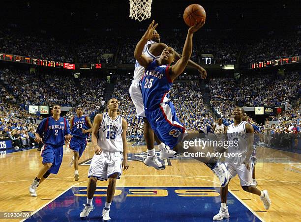 Michael Lee of the Kansas Jayhawks shoots against Joe Crawford of the Kentucky Wildcats on January 9, 2005 at Rupp Arena in Lexington, Kentucky....