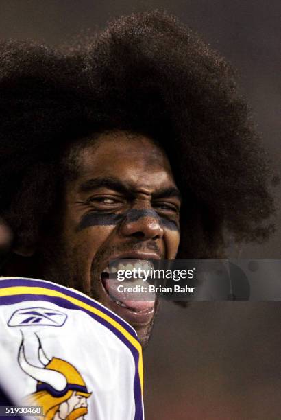 Wide receiver Randy Moss of the Minnesota Vikings jokes with teammates on the sideline while taking on the Green Bay Packers in the NFC wild-card...