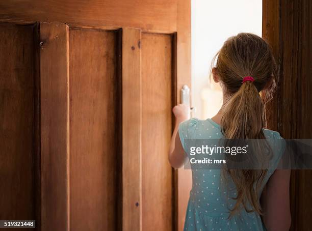 girl walking through door - latvia girls stock pictures, royalty-free photos & images