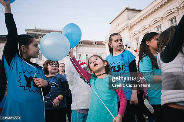 Children launch blue balloons in Celebration Of World Autism Awareness Day on April 2, 2016 in Arad, Romania.