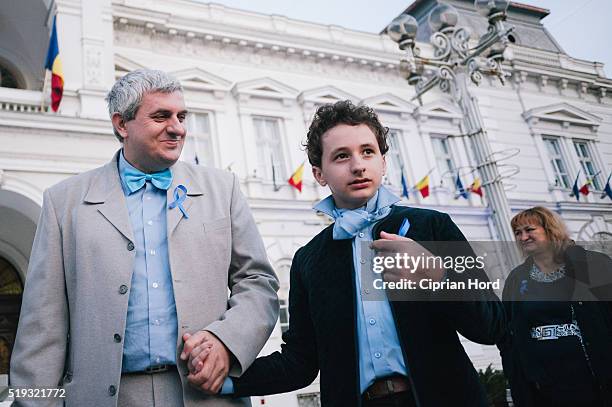 An autistic boy attends a rally in Celebration Of World Autism Awareness Day on April 2, 2016 in Arad, Romania.