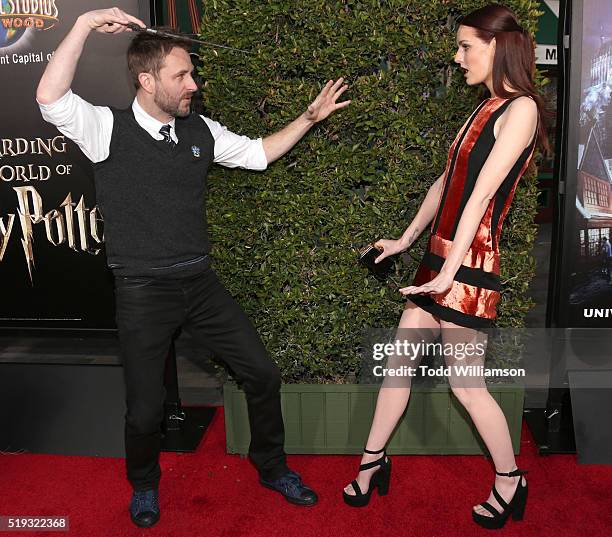 Chris Hardwick and Lydia Hearst play with a wand at the Opening Of "The Wizarding World Of Harry Potter" at Universal Studios Hollywood on April 5,...