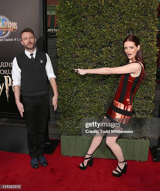 Chris Hardwick and Lydia Hearst play with a wand at the Opening Of "The Wizarding World Of Harry Potter" at Universal Studios Hollywood on April 5,...