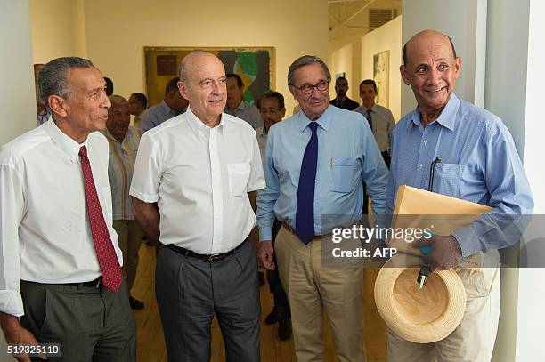 Mayor of Bordeaux and candidate for Les Republicains right-wing party primary Alain Juppe speaks with regional councillor of Fort-de-France Miguel...