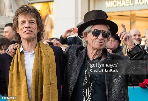 Mick Jagger and Keith Richards arrive for the private view of 'The Rolling Stones: Exhibitionism' Saatchi Gallery on April 4, 2016 in London, England.