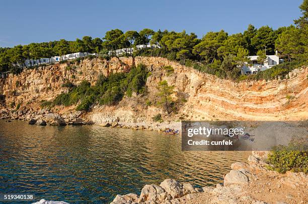 crowded marpunta beach, alonissos - alonissos stock pictures, royalty-free photos & images