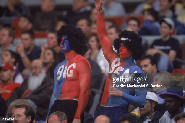 Two avid fans cheer on Ben Wallace of the Detroit Pistons during game 5 of the Eastern Conference quarterfinals against the Toronto Raptors during...