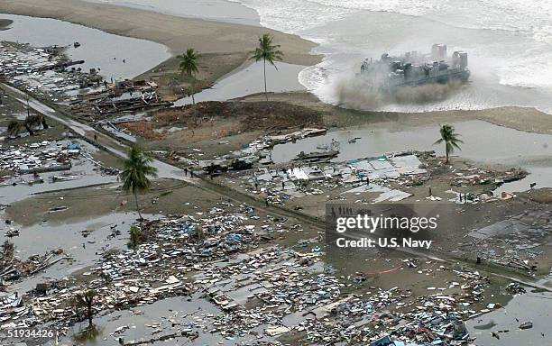 In this U.S. Navy handout photo, a Landing Craft Air Cushion vehicle is seen en route to deliver much needed materials and supplies to the citizens...