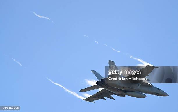 An F/A 18E Super Hornet from the United States Navy fighter squadron VFA-115 conducts a bombing run on April 6, 2016 in Townsville, Australia....