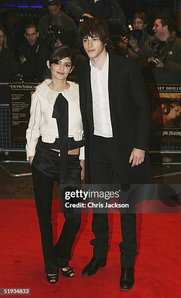 Actors Audrey Tautou and Gaspard Ulliel arrive at the UK Premiere of "A Very Long Engagement" at Odeon West End on January 10, 2005 in London.