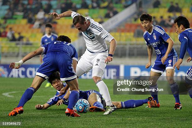 Besart Berisha of Melbourne Victory competes for the ball with Ku Ja-Ryong of Suwon Samsung Bluewings FC during the AFC Champions League Group G...