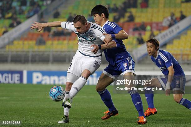 Besart Berisha of Melbourne Victory competes for the ball with Ku Ja-Ryong of Suwon Samsung Bluewings FC during the AFC Champions League Group G...