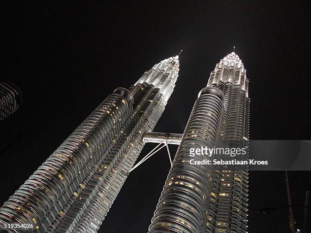 the two petronas towers at night, kuala lumpur, malaysia - 1996 stock pictures, royalty-free photos & images
