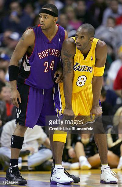 Morris Peterson of the Toronto Raptors lines up with Kobe Bryant of the Los Angeles Lakers during the game on December 28, 2004 at Staples Center in...
