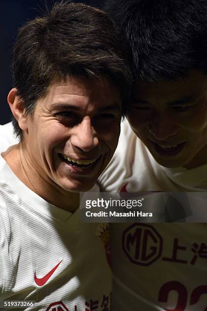 Dario Leonardo Conca and Sun Xiang of Shanghai SIPG look on after the AFC Champions League Group G match between Gamba Osaka and Shanghai SIPG FC at...