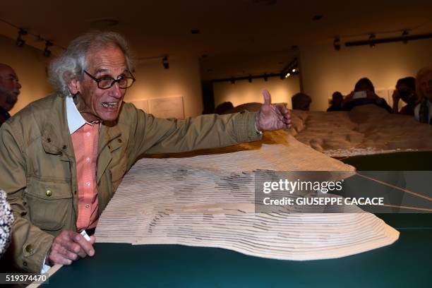 Bulgarian artist Christo gestures as he visits the exhibition "Christo and Jeanne-Claude, Water Projects" at Santa Giulia Museum in Brescia on April...