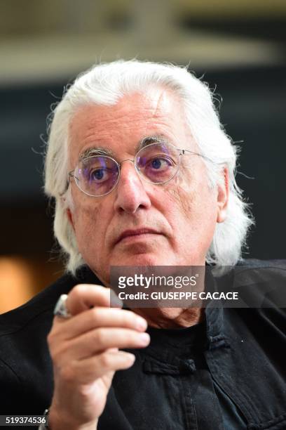 Italian curator Germano Celant gestures during a press conference on the exhibition "Christo and Jeanne-Claude, Water Projects" at Santa Giulia...