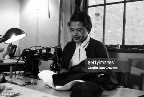 American Civil Rights activist Rosa Parks at work as a seamstress, shortly after the beginning of the Montgomery bus boycott, Montgomery, Alabama,...