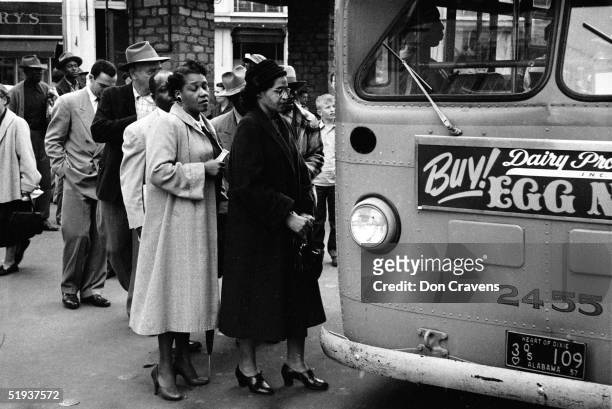 American Civil Rights activist Rosa Parks waits to board a bus at the end of the Montgomery bus boycott, Montgomery, Alabama, December 26, 1956.