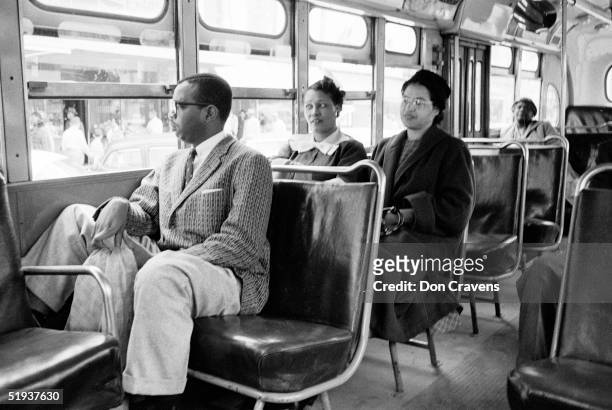 American Civil Rights activist Rosa Parks rides a bus at the end of the Montgomery bus boycott, Montgomery, Alabama, December 26, 1956.