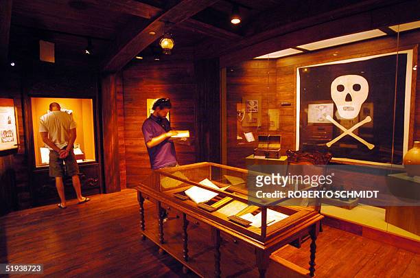 One of only two existing original Jolly Roger pirate flags is displayed in one of the alcoves of the Pirate Soul Museum 10 January 2005 in Key West,...