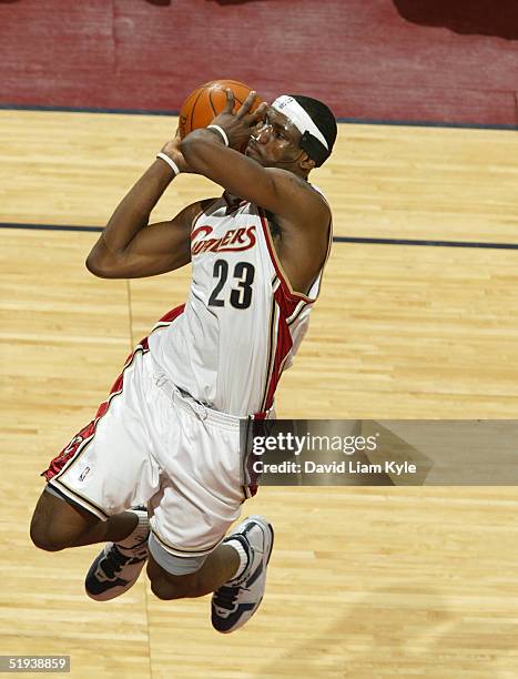 LeBron James of the Cleveland Cavaliers goes up for a dunk against the Charlotte Bobcats on January 11, 2005 at Gund Arena in Cleveland, Ohio. NOTE...