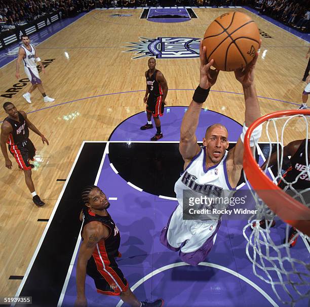 Doug Christie of the Sacramento Kings drives to the basket during a game against the Miami Heat at Arco Arena on December 23, 2004 in Sacramento,...