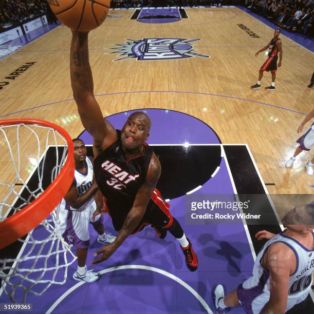 Shaquille O'Neal of the Miami Heat dunks during a game against the Sacramento Kings at Arco Arena on December 23, 2004 in Sacramento, California. The...