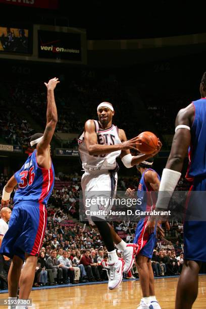 Vince Carter of the New Jersey Nets looks for the pass against the Detroit Pistons on January 11, 2005 at Continental Airlines Arena in East...