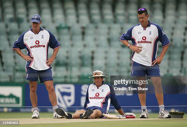 Andrew Strauss, Michael Vaughan and Ashley Giles of England look at the wicket during the England nets session on January 12, 2005 at the Wanderers...